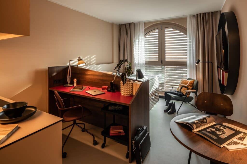 Room With Desk Area And Double Bed