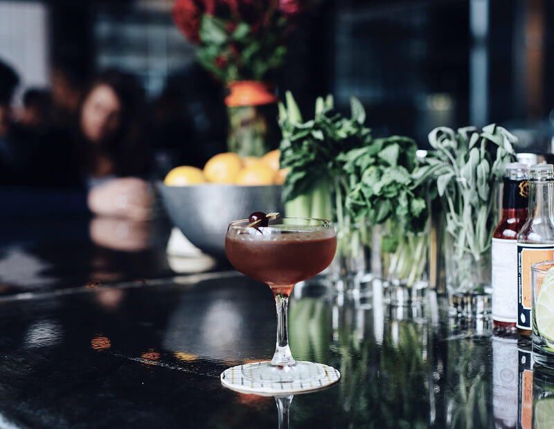 Drinking cocktails at a cozy bar