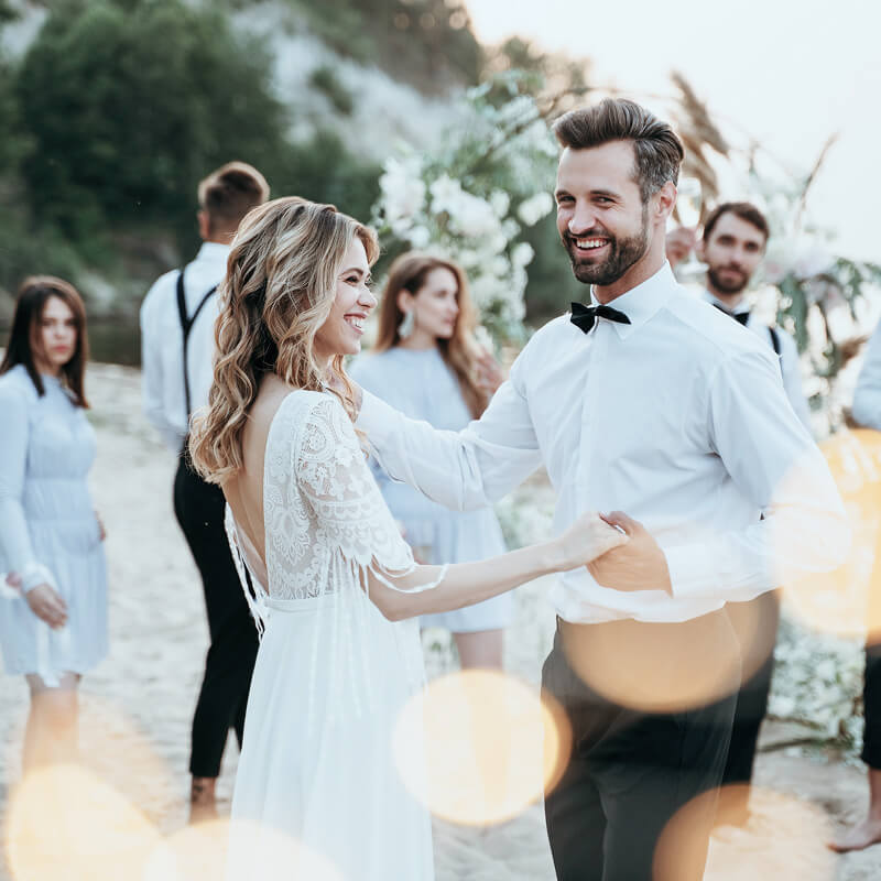 Happy wedding couple celebrates wedding with loved ones